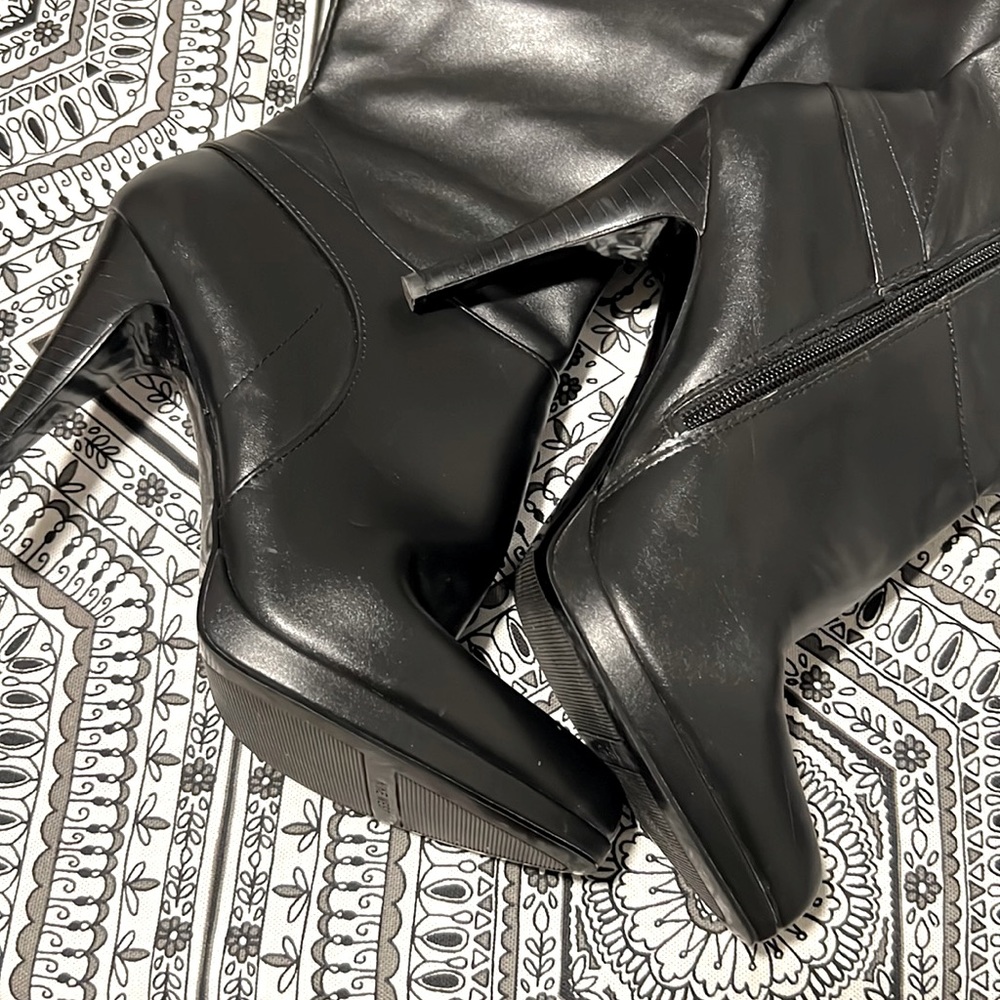 Knee high black leather boots